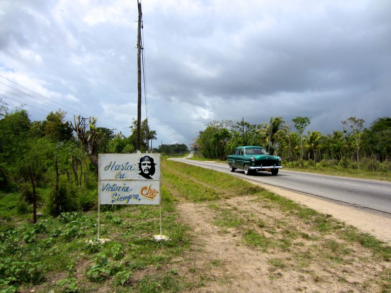 Cycling Cuba: Sign and car