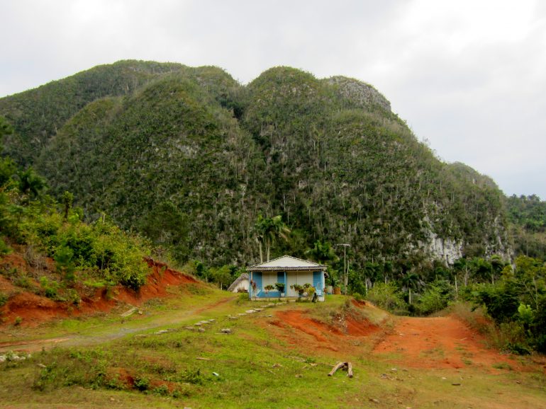 Cycling Cuba: House in front of a hill