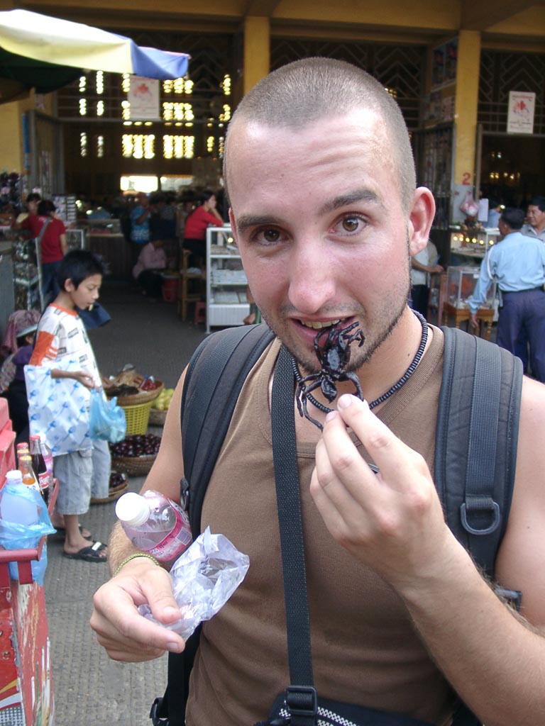 Strange foods: Marco Buch eating a fried tree spider