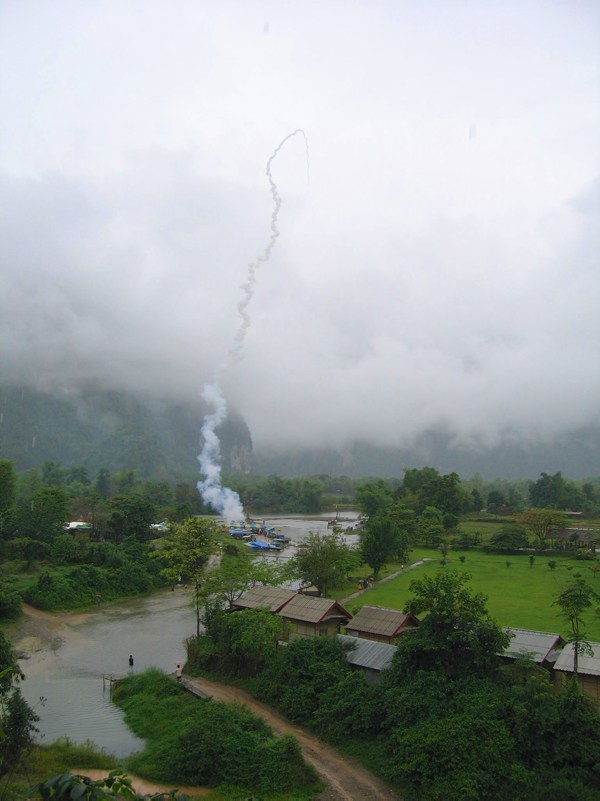 Festivals around the world: Rocket taking off over field and jungle