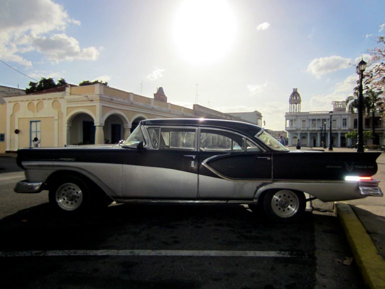 Cuba cars: American classic car in front of colonial architecture